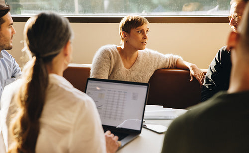 Businesswoman in meeting with team