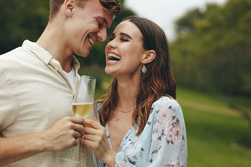 Couple at park with champagne