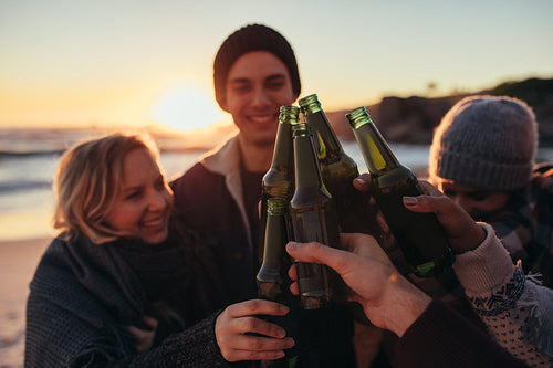 Young friends partying at the beach