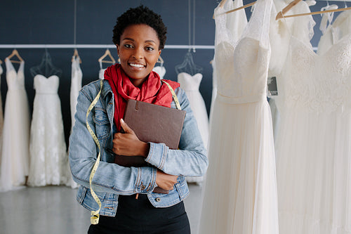 Wedding dress store owner with a diary