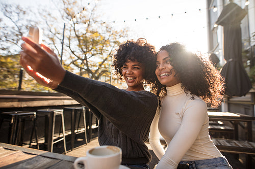 Two happy women having fun taking a selfie