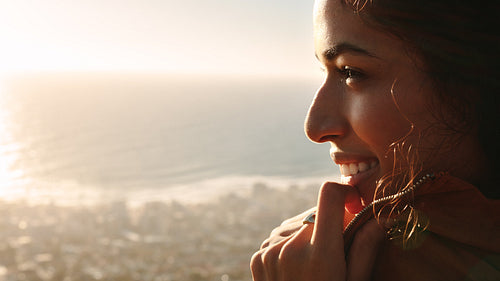 Smiling woman looking at beautiful view