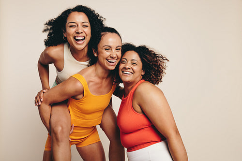 Fitness friends celebrate their active lifestyle in sportswear