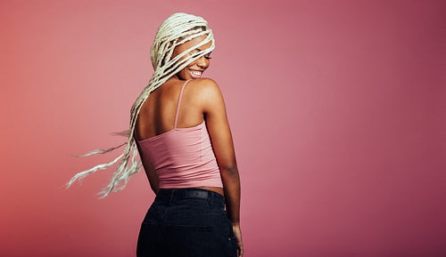 Rear view of smiling african american woman