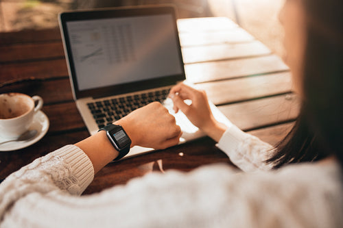 Woman checking her smartwatch