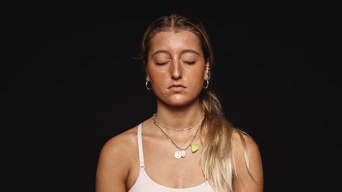 Close up of a woman with closed eyes