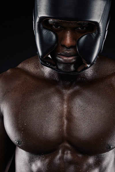 African boxer wearing protective head guard