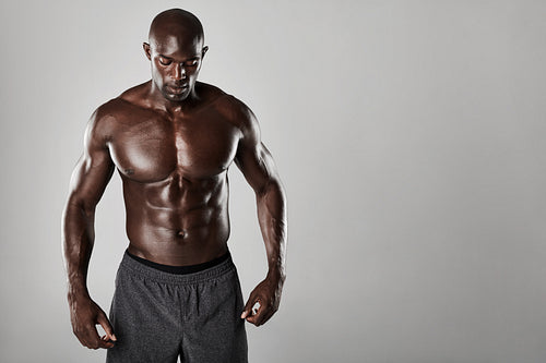 Shirtless male african model with muscular build