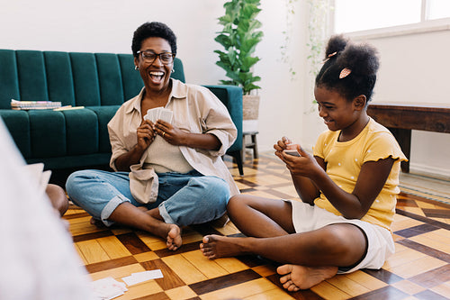 Mother and daughter enjoying fun game time together