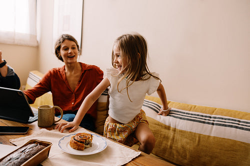 Family scene with a girl and mother at home