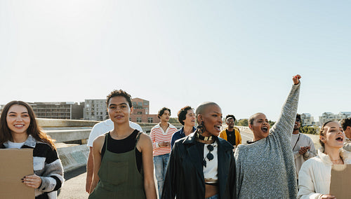 Diverse group demonstrating together during a peaceful protest on a sunny day