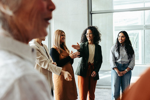 Diverse group of professionals interacting at a business workshop during a conference
