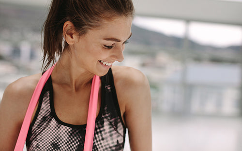 Relaxed female after her workout at gym