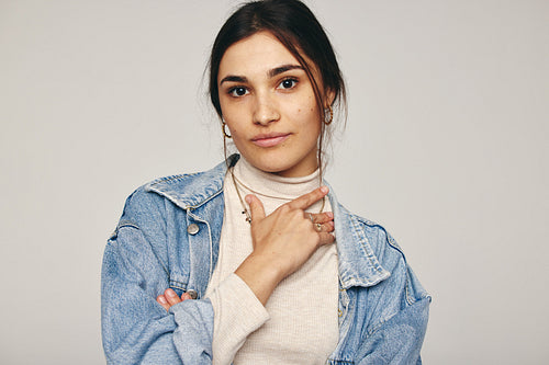 Young woman looking at the camera in a studio