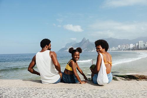 Happy family enjoying a summer day at Ipanema Beach