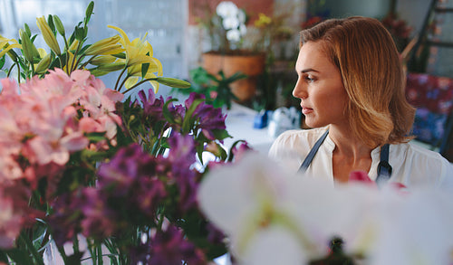 Woman working in flower shop