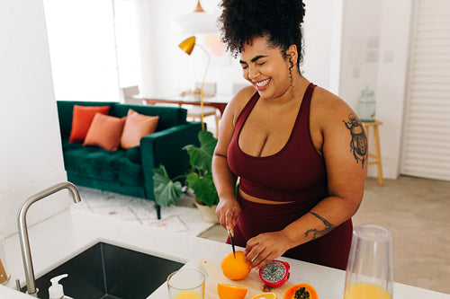 Woman preparing juice at home