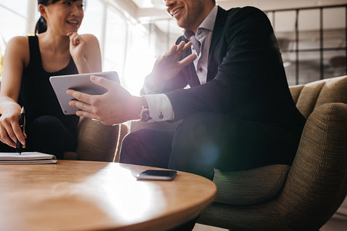 Business partners using digital tablet