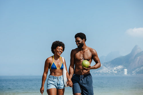 Brazilian couple enjoying a sunny day at Ipanema Beach