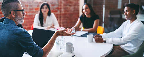 Businessman leading a meeting in a modern office