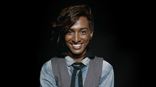  Fashionable male laughing on black background