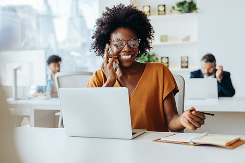 Successful businesswoman using modern technology in office