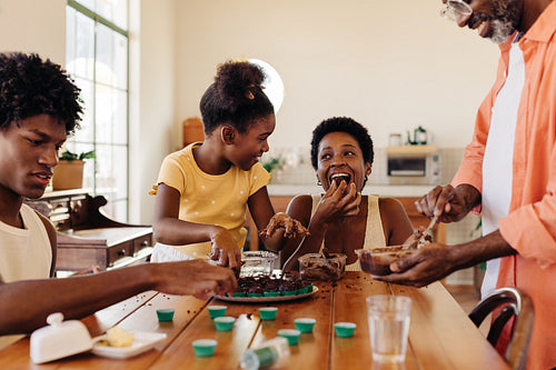 Brazilian family having fun in the kitchen, making traditional brigadeiro dessert together