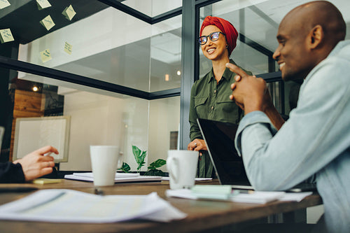 Female team leader having a meeting with her colleagues