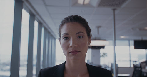 Confident young businesswoman in office