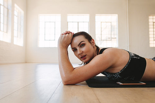 Fit woman relaxing after workout
