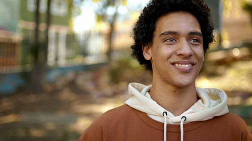 Happy young man looking away and smiling
