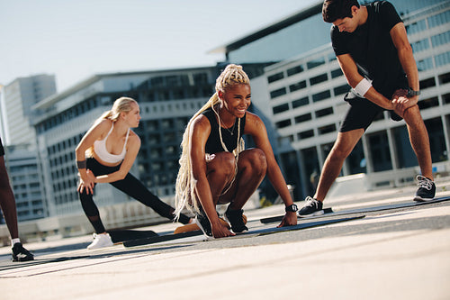 Group of people exercising together in the city