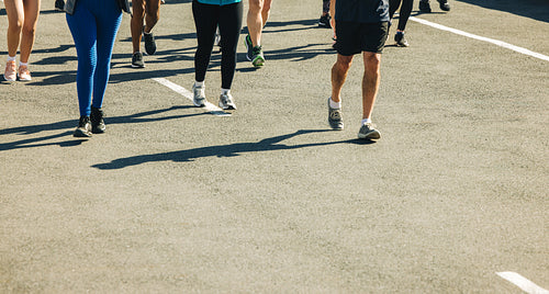 Group of runners on the road with copy space
