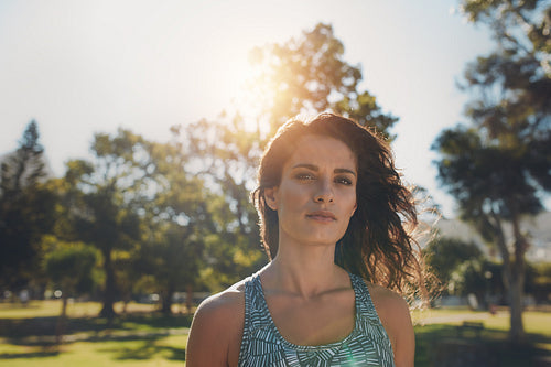Beautiful young fitness woman in the par