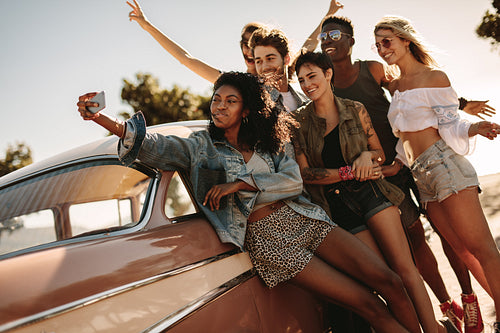 Friends on road trip posing for a selfie