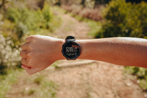 Close up of a hand of a person wearing a smart watch
