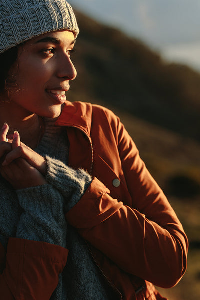 Woman in warm wear looking away