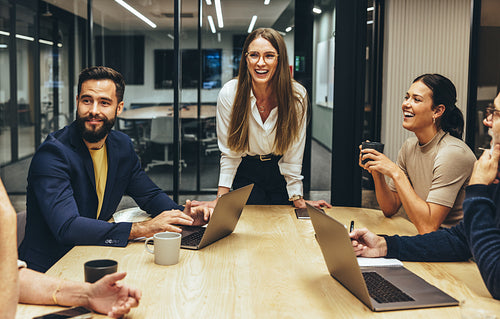 Happy businesspeople laughing during a meeting