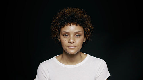Woman standing on black background