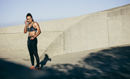 Sportswoman taking break from fitness workout