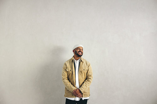 Happy millennial businessman smiling in an office
