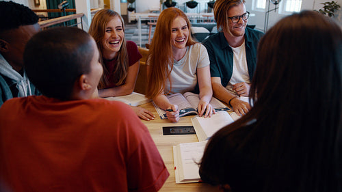 College classmates smiling during group study