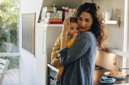 Mother consoling her baby