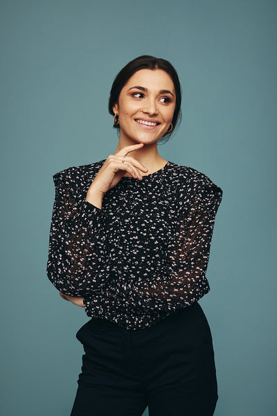 Cheerful young woman looking away with a smile