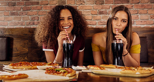 Female friends having lunch at restaurant