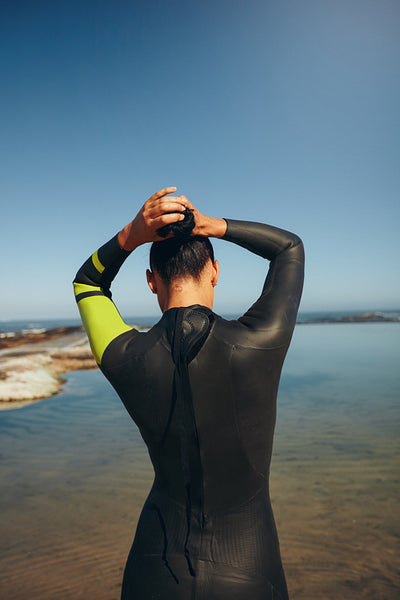 Female triathlon athlete getting ready for the competition