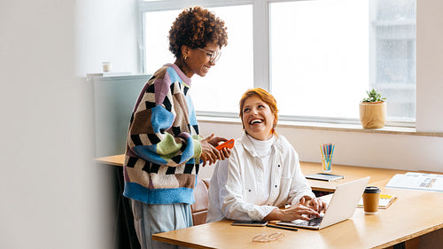 Colleagues collaborating in a freelance co-working space