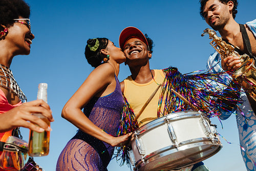 Friends celebrate with music, dance, and joy