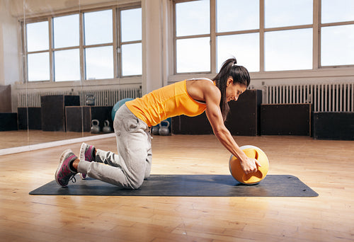 Young woman exercising with kettle bell