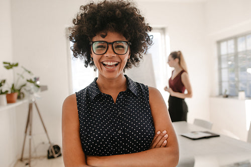 Woman laughing during presentation in office